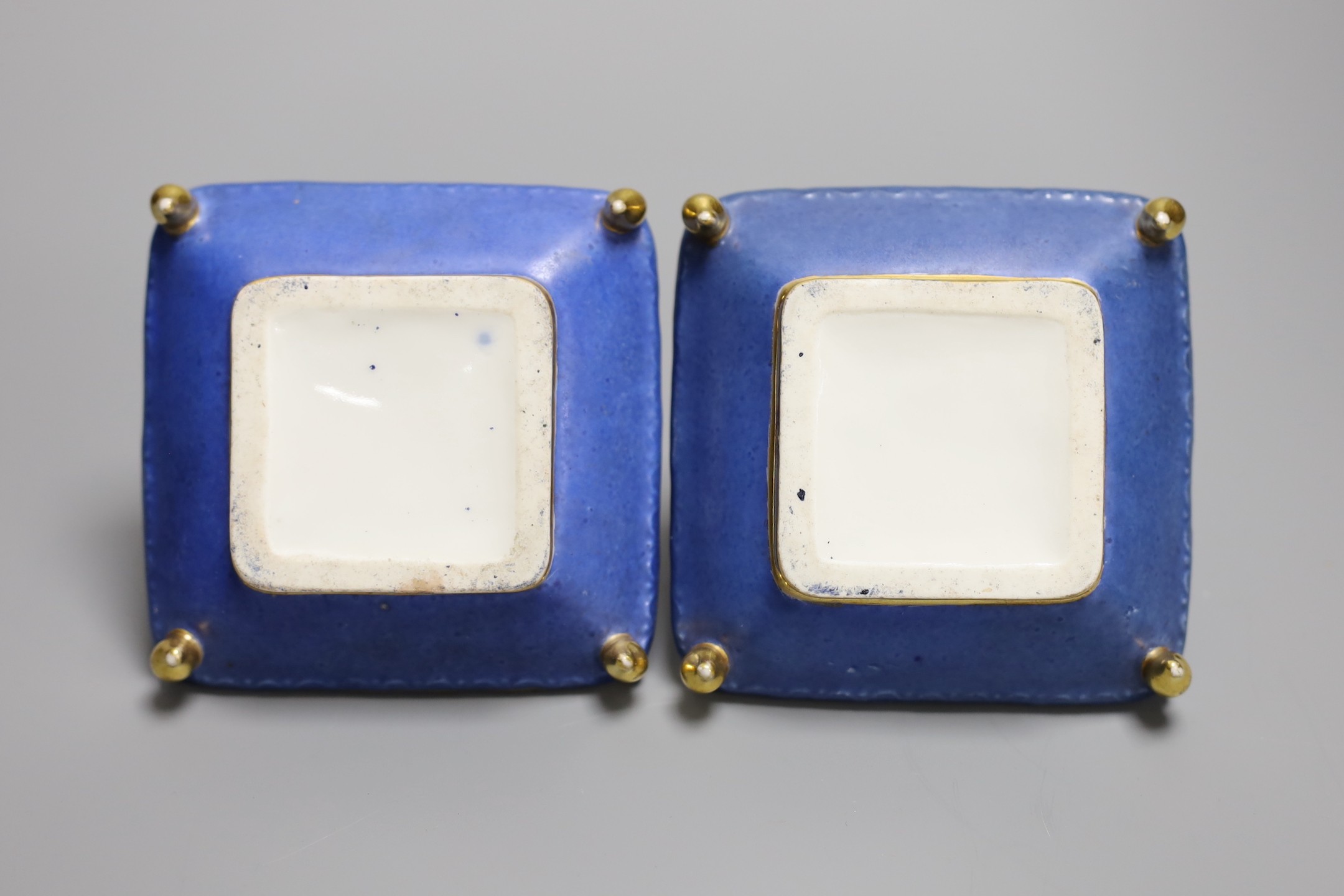 A pair of mid 19th century Paris porcelain 'cushion' shaped scent bottles decorated in Sevres style with pink roses (lacking stoppers)